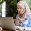 woman-using-laptop-some-cafe-alone-woman-using-laptop-some-cafe-114253806